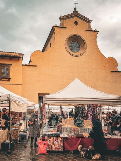 A view of a market in a piazza in Florence