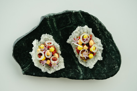 catering food - canapes example presented on stone