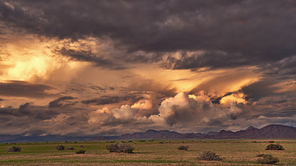 Sunset with rain clouds over the Naukluft Mountains at the edge of the Namib Desert, Namibia in the rainy season 2025