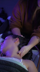 Woman receiving a relaxing head spa treatment