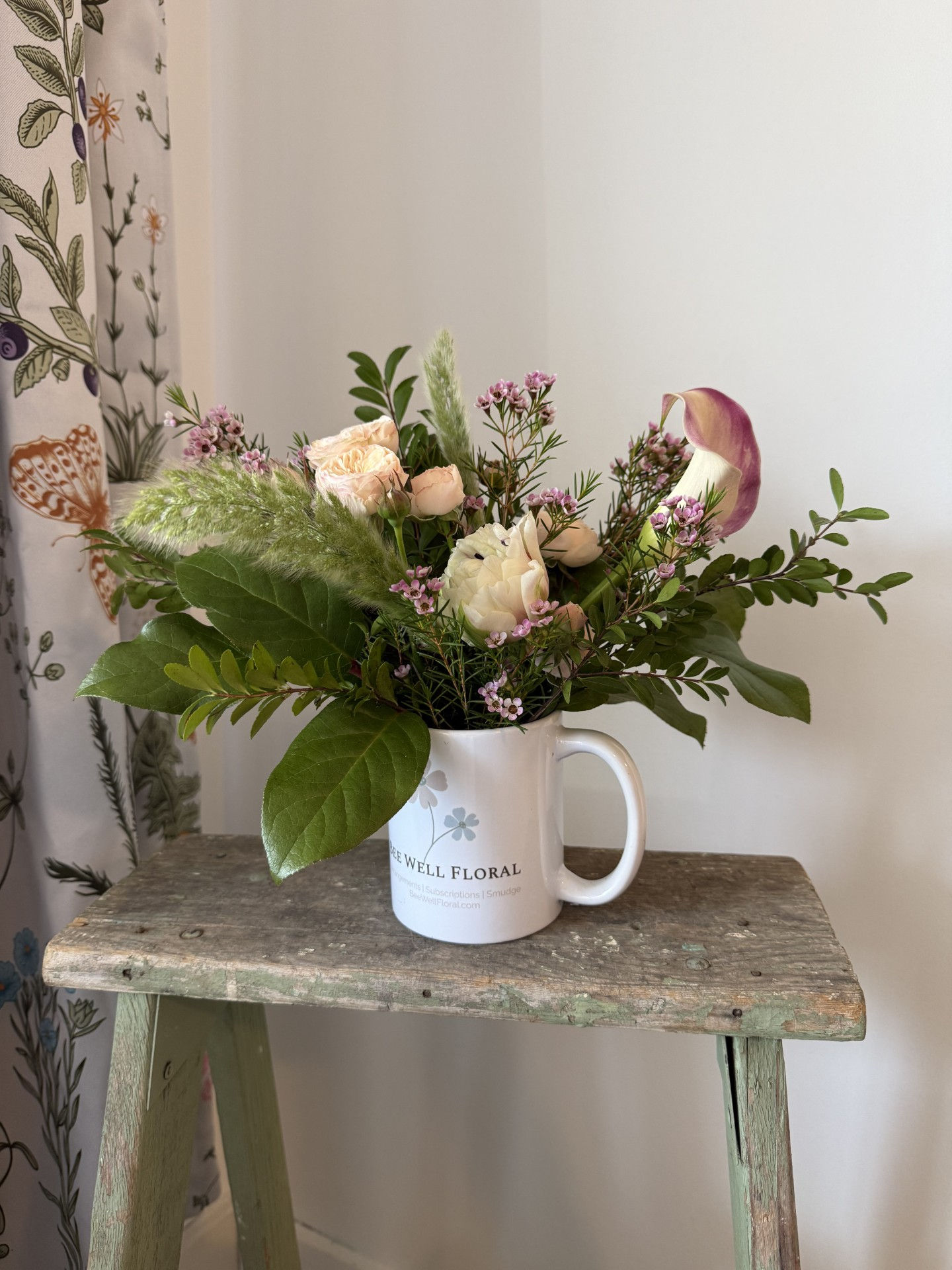 Signature mug flower arrangement with pink hues