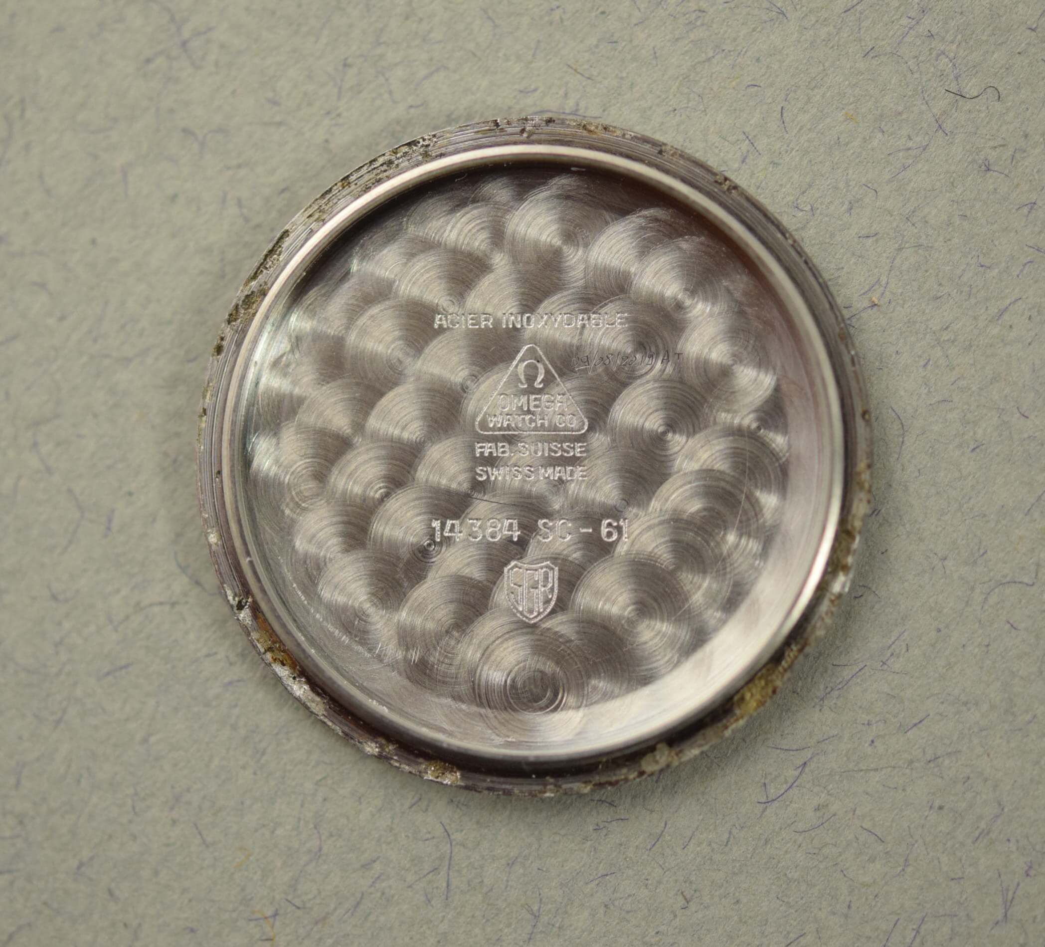 Omega Seamaster 14384. Internal back 14384 SC-61. · Photo: Vision Vintage Watches · © Vision Vintage Watches; permission not yet confirmed · Source: https://www.visionvintagewatches.com/product-page/1961-omega-seamaster-ribbon-dial-14384
