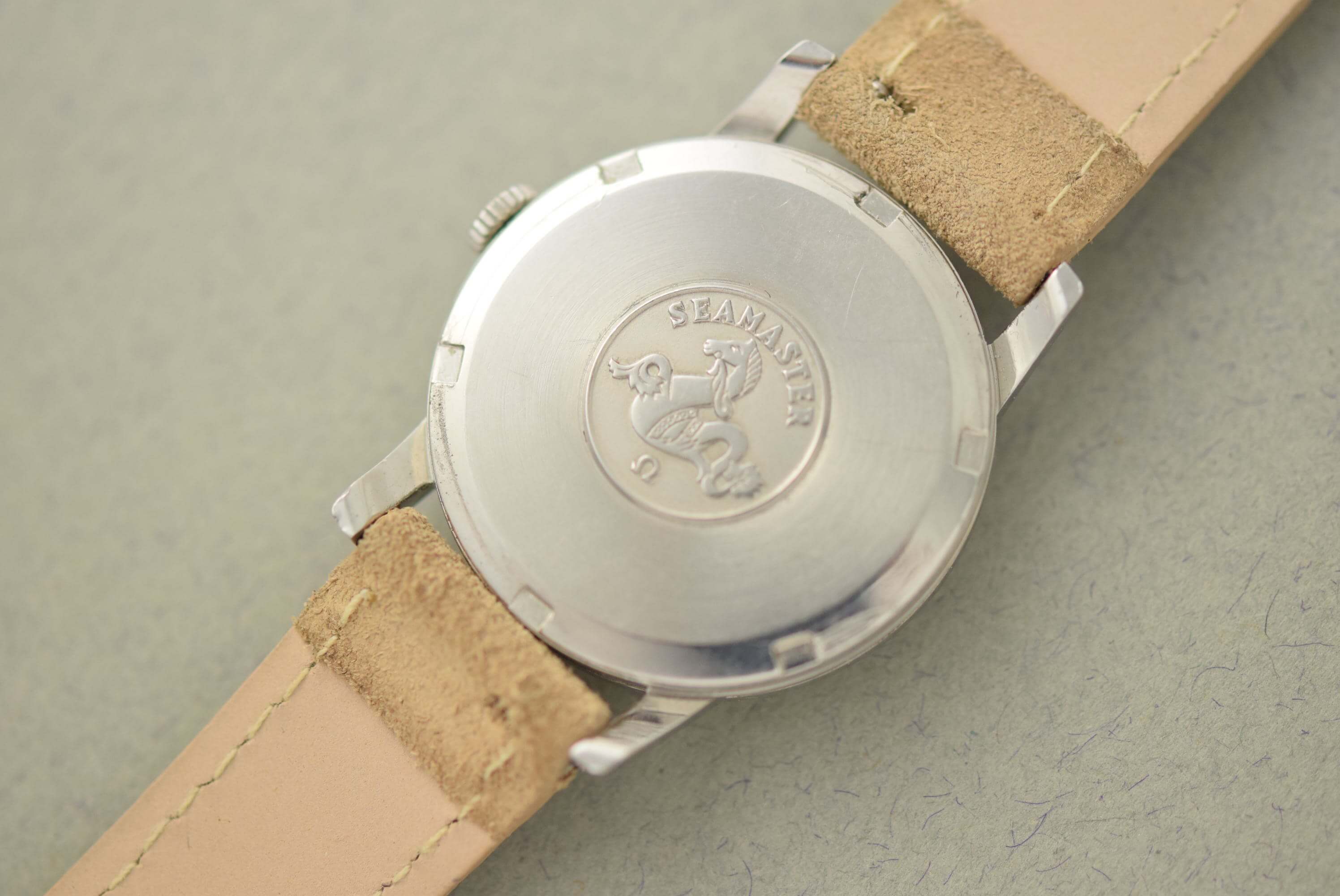 Omega Seamaster 14384. External Seamaster caseback. · Photo: Vision Vintage Watches · © Vision Vintage Watches; permission not yet confirmed · Source: https://www.visionvintagewatches.com/product-page/1961-omega-seamaster-ribbon-dial-14384