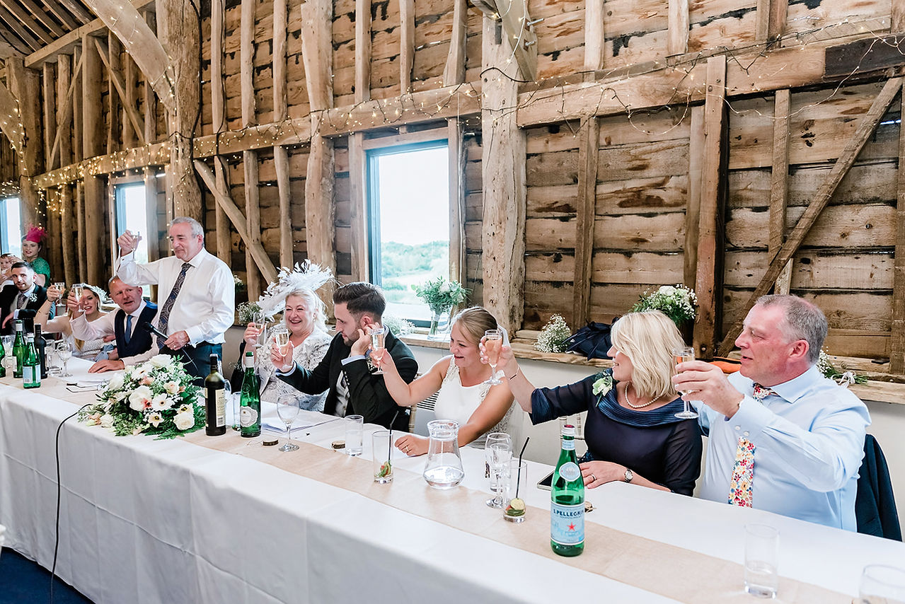 Wedding toasts at Newton Park Farm barn