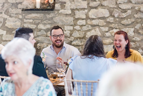 Guests laughing at Priston Mill wedding breakfast