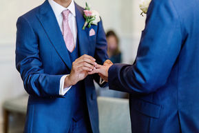 two-grooms-exchanging-wedding-rings.jpg