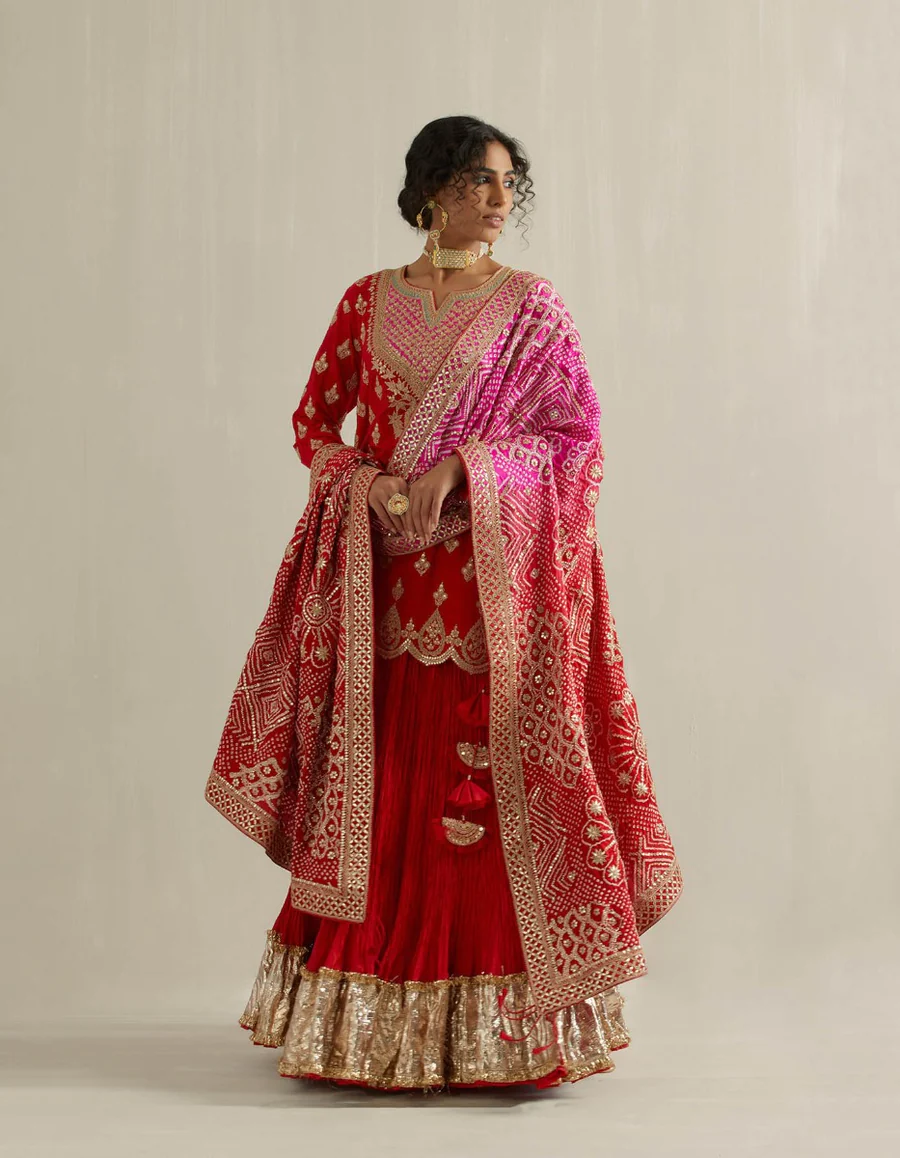 Nidhi Tholia red kurta with a crinkled skirt