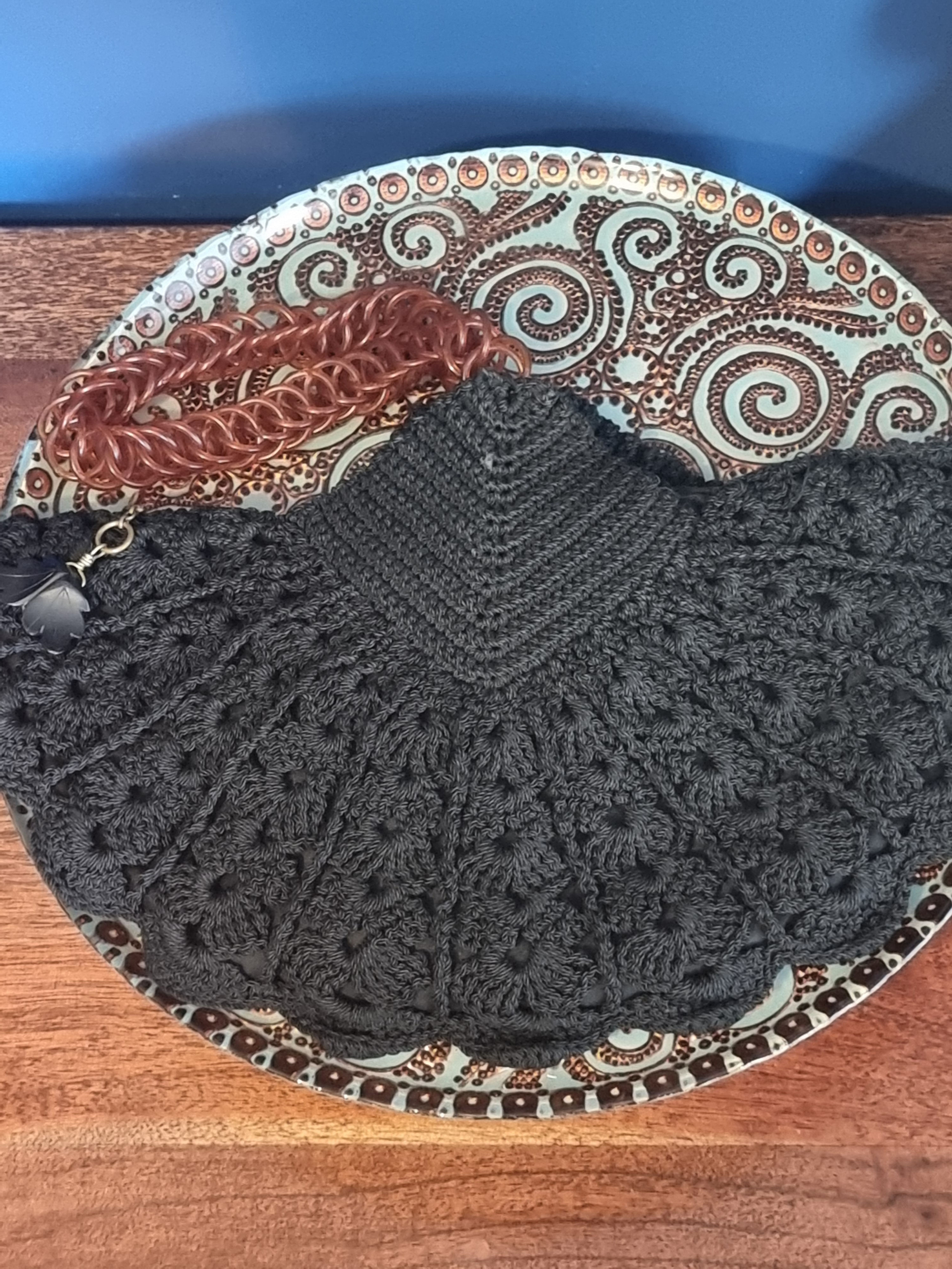 Crochet fan bag with telephone wire strap