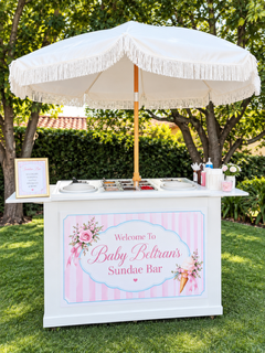 Wide-angle view of a luxury ice cream cart at an outdoor celebration.