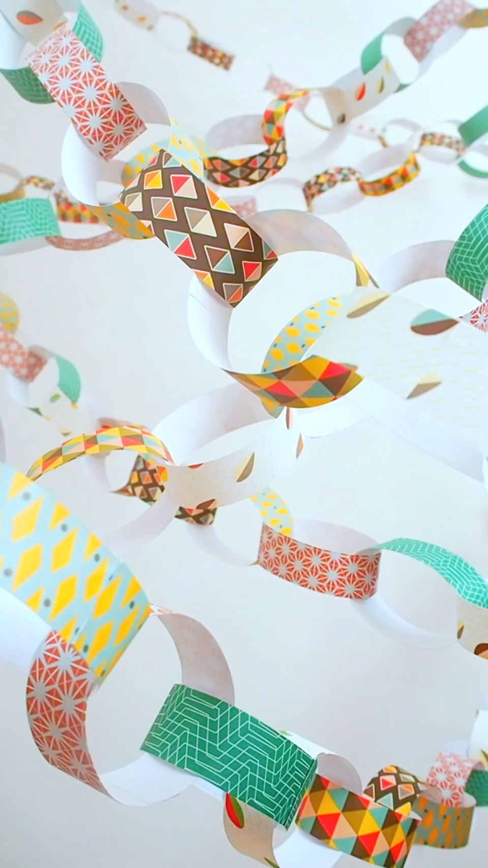 Paper chain hung -  A Vintage Crafting Classic: How to Make a Paper Chain With Bright Stem Recyclable Wrapping Paper