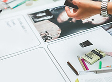 Hands Working on Magazine Print