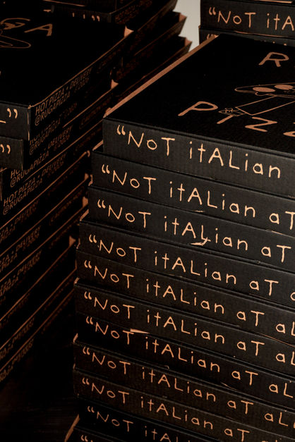 Stack of books titled "Not Italian at All."