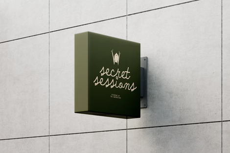 Green sign with "secret sessions" text and icon.