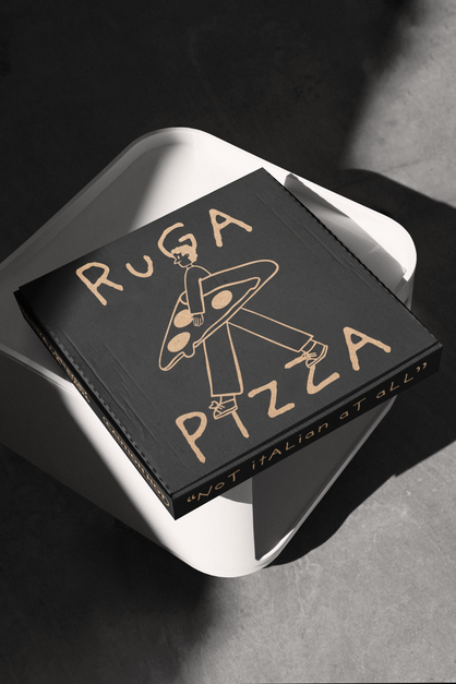 Pizza box with "Ruga Pizza" design on top.