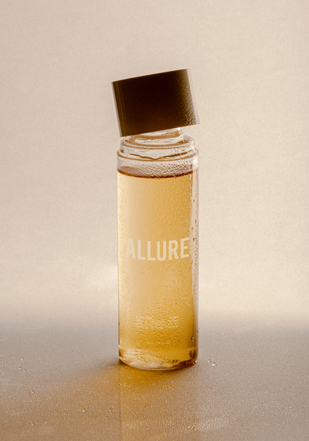 Small bottle labeled "Allure" with a tilted cap.