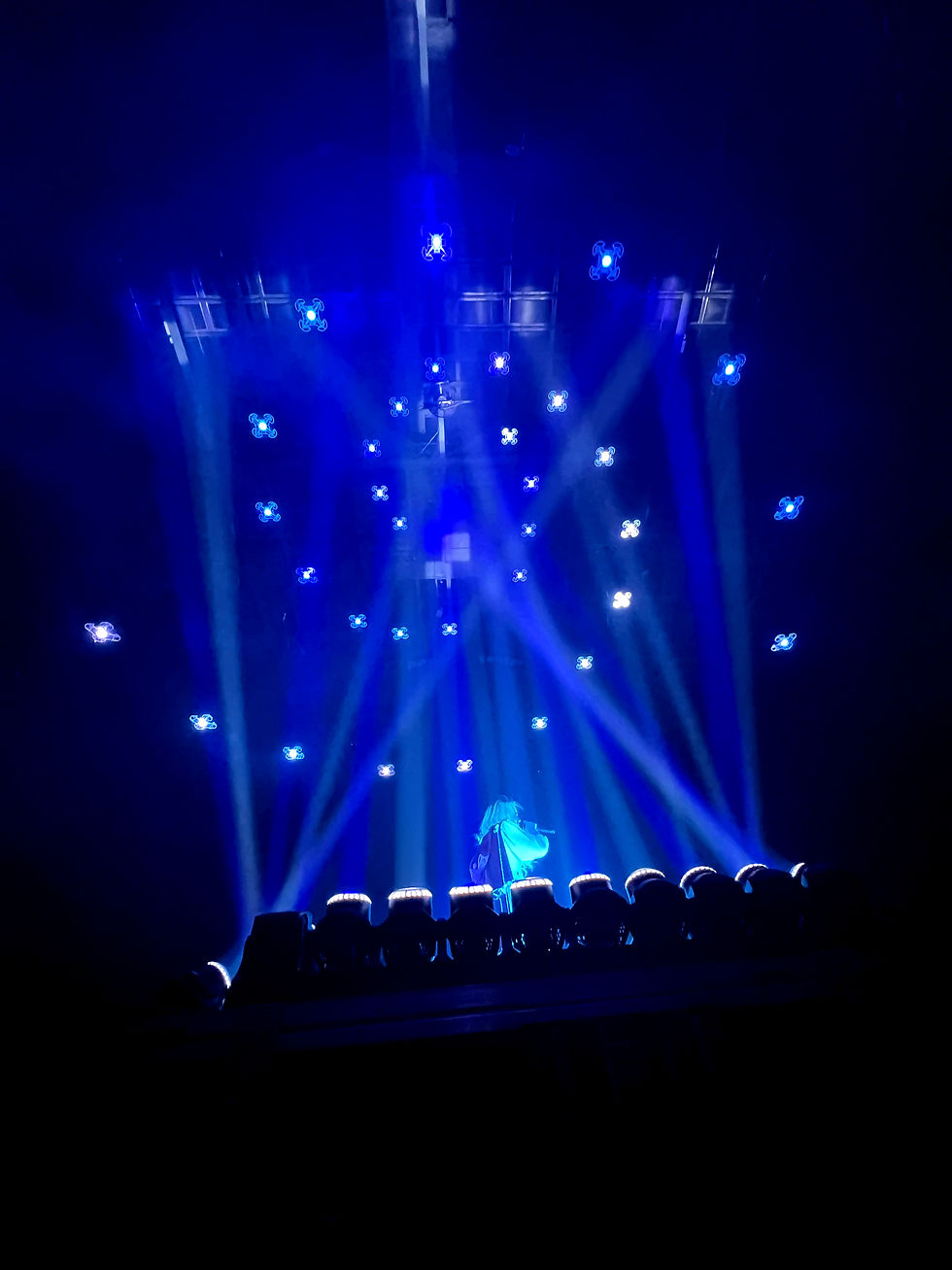 drones fly above TSO performers during their 2025 Christmas tour. Drones by Illuminate Drones