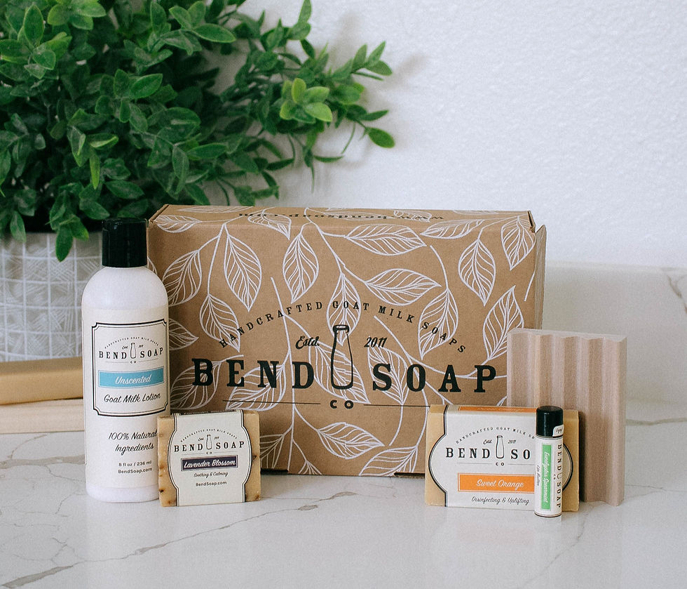 Thumbnail: Bend Soap Co. Gift Set goat milk lotion, bar soap, travel soap, soap dish, and lip butter displayed in front of gift box