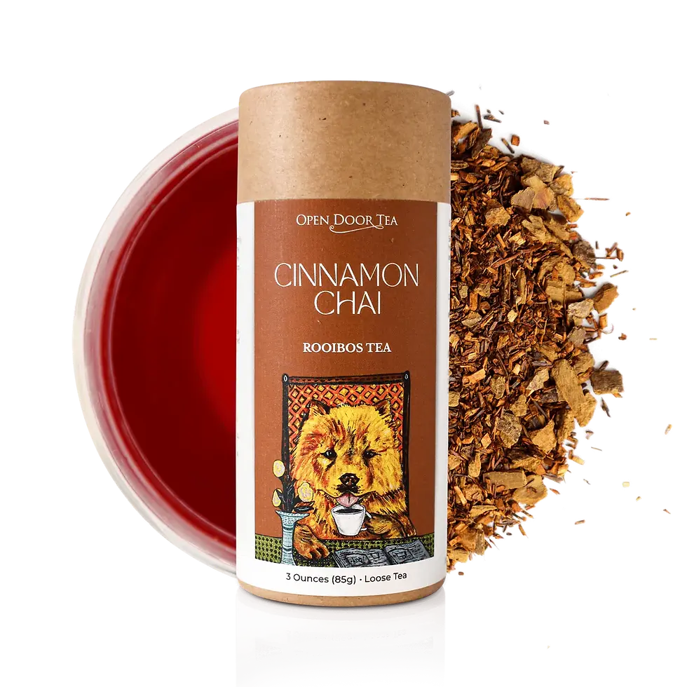 Open Door Tea Cinnamon Chai Rooibos Tea container. Logo and a Chow sipping tea. Loose-leaf tea and tea color backdrop.