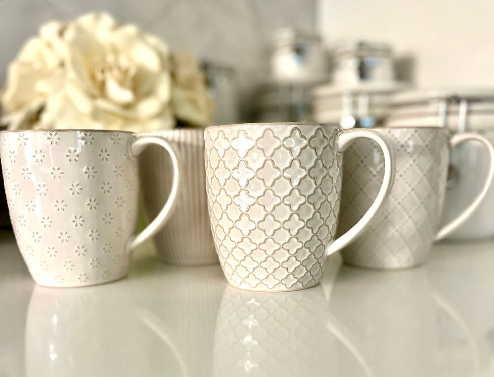 Thumbnail: Getstar Ceramic Coffee Mugs set of 4 on kitchen countertop. Zoomed in to show design detail.
