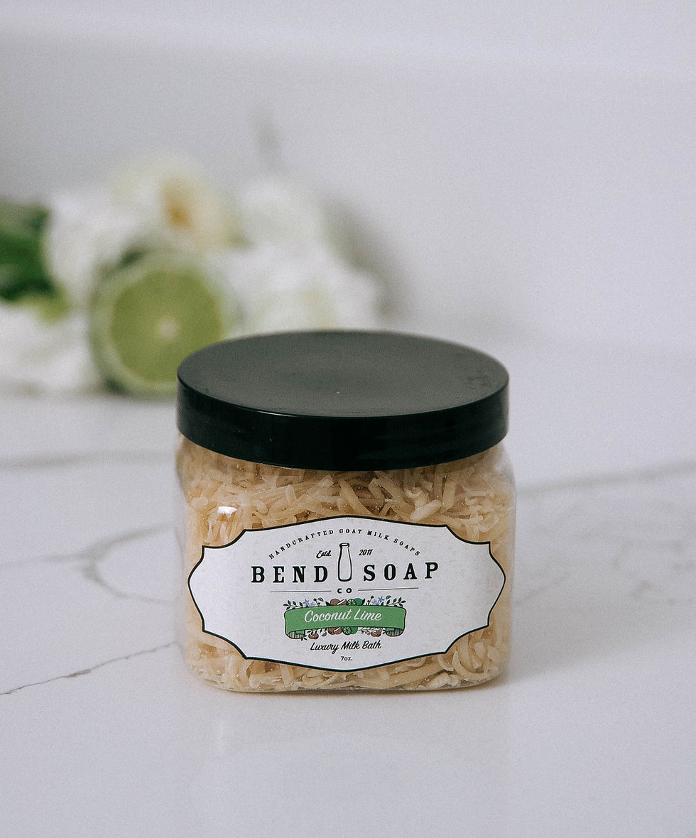 Bend Soap Co. Coconut Lime Goat Milk Bath Soak jar on white marble with lime half