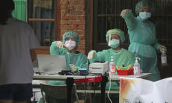 Medical workers wearing protective equipment during the COVID pandemic.