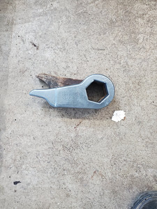 Old control arm next to a new heavy-duty replacement part, demonstrating the difference in condition and quality at Baldassarre Automotive.