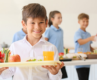 Schoolboy having lunch in school canteen.jpg