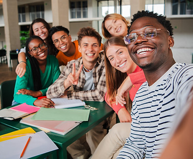 Happy young students taking a vertical selfie portrait together at university library. Afr