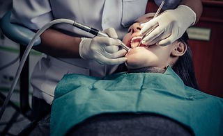 dentists-treat-patients-teeth.jpg
