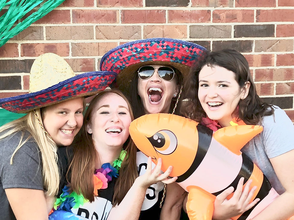 That's me, the one in the middle behind the fish. And to my left (your right), that beauty is my sweet student and friend, Rachel.