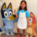 girl with biscuit at bluey themed kids baking camp