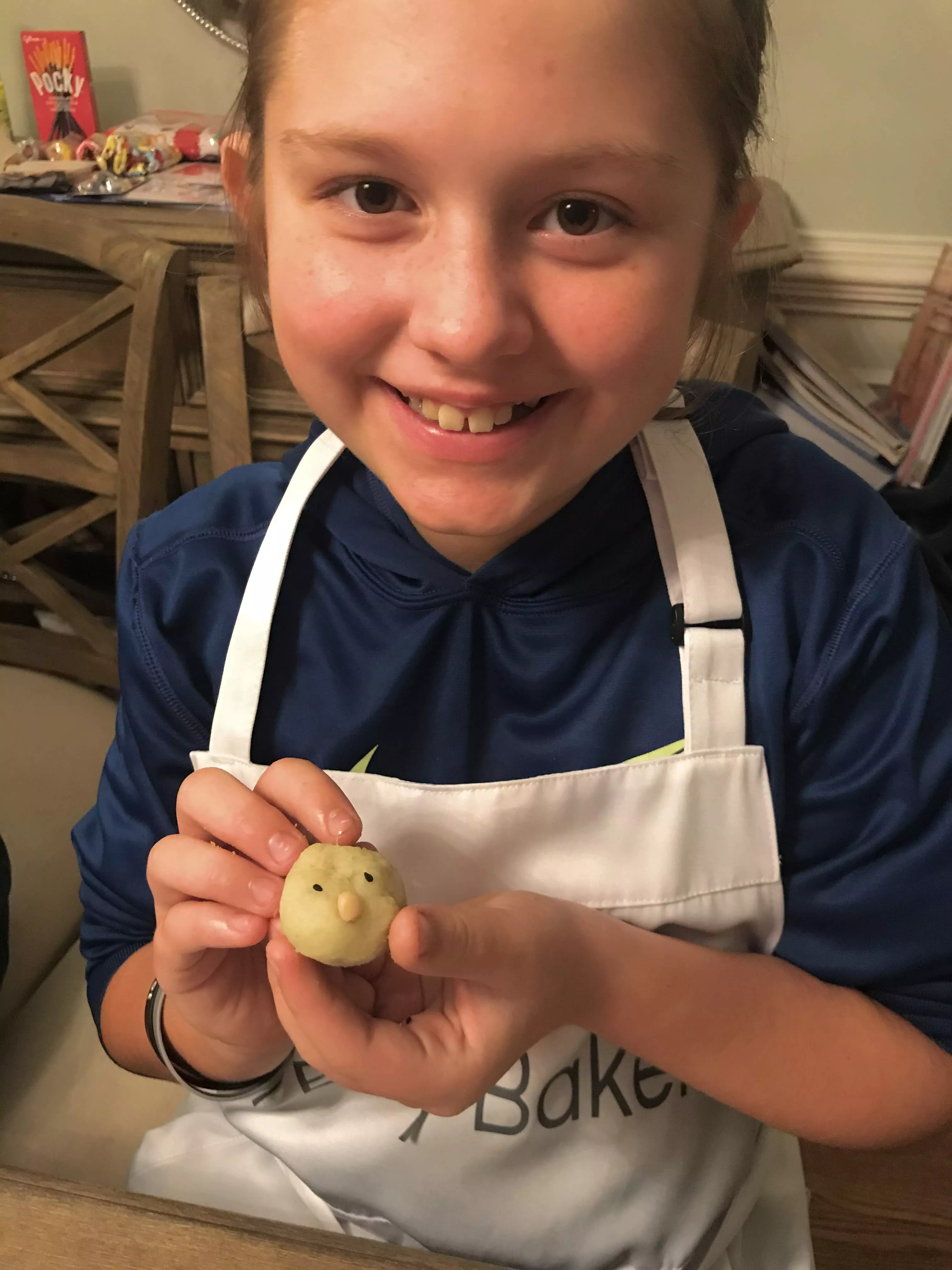 teen girl holds a sweet potato cake