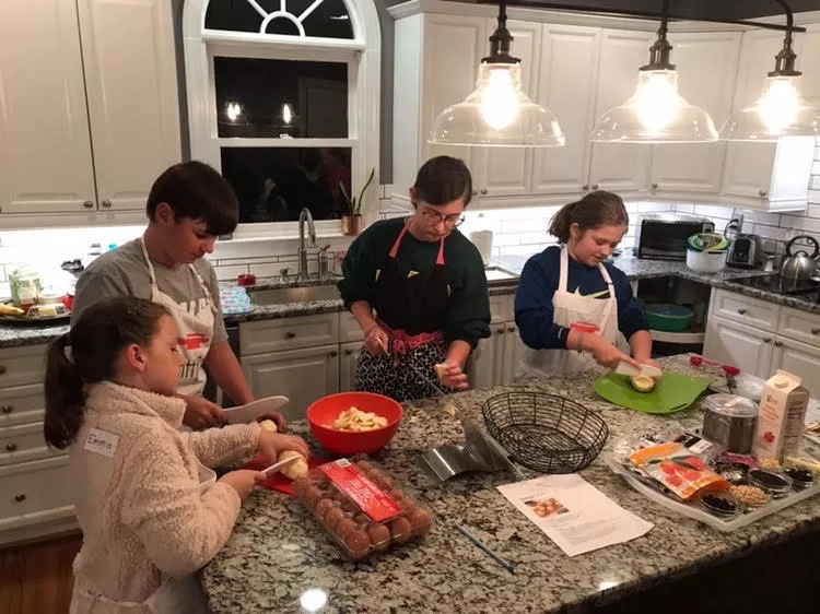 Kids getting to work on the sweet potatoes.
