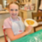 student baker with Mickey pretzel at a kids baking camp in hoover alabama