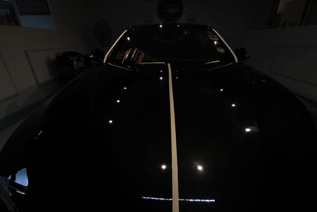 Before and after of MintGroom paint correction on a car panel