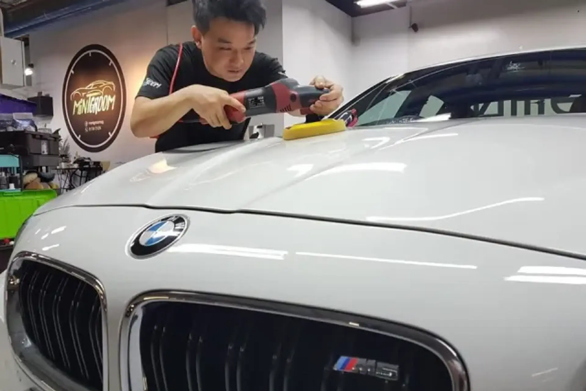 A car being detailed under MintGroom's panel lighting in Singapore