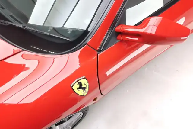 Ceramic coating being applied by hand to a car panel