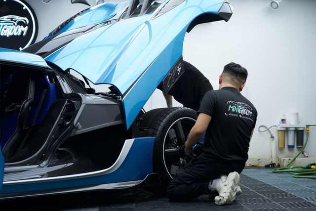 Paint protection film edge being tucked in during installation at MintGroom