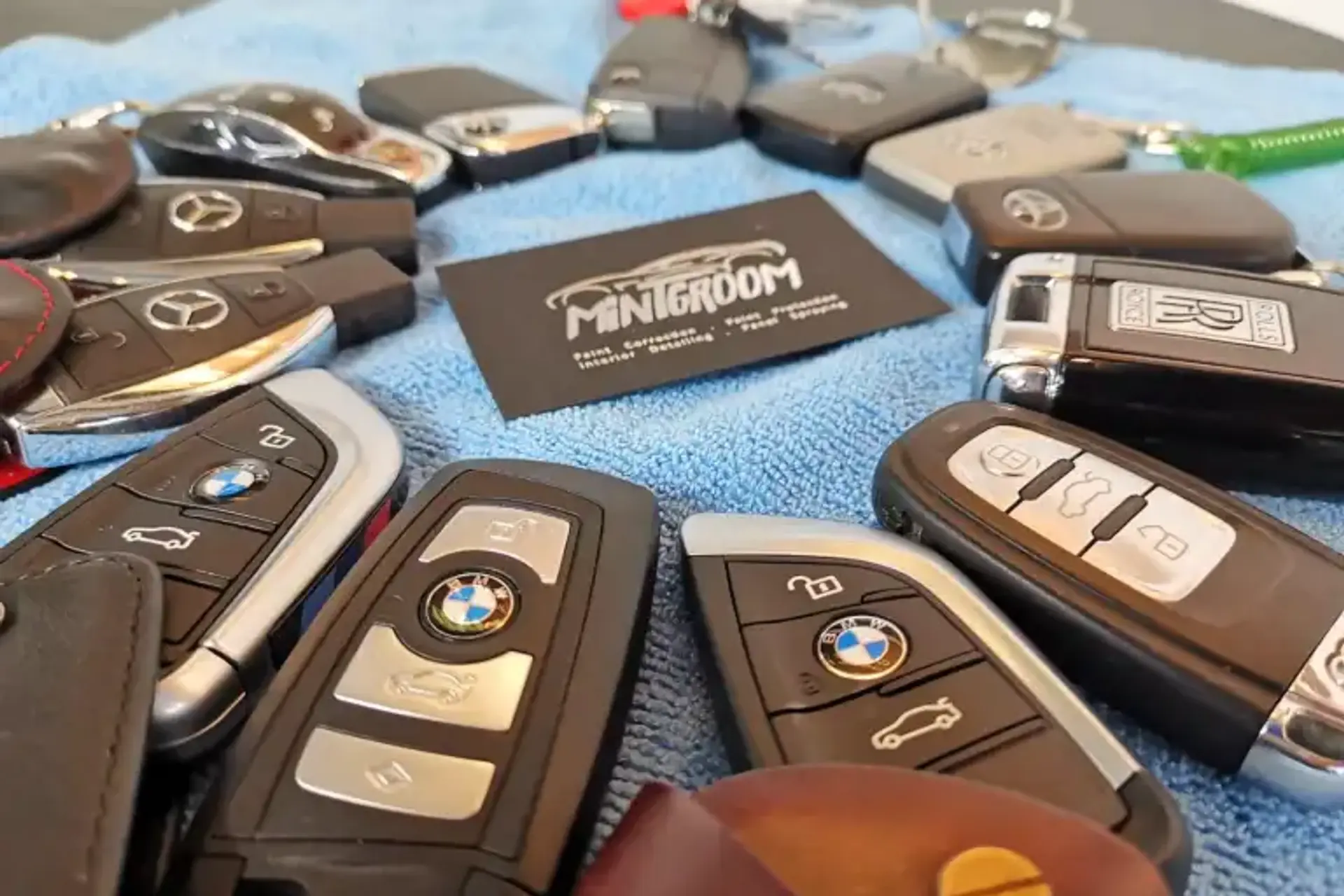 MintGroom technicians cleaning a corporate vehicle fleet