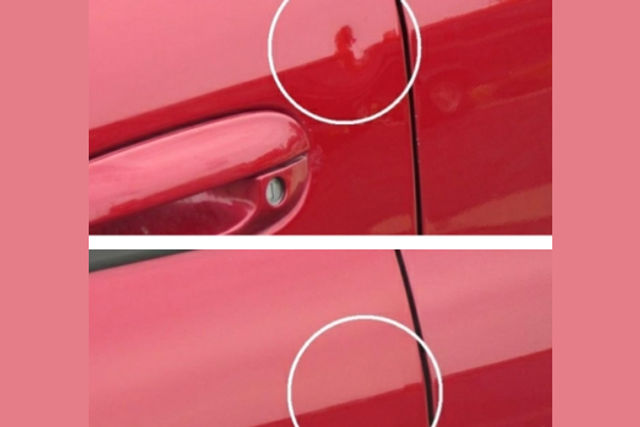 Paintless dent removal being carried out on a car panel