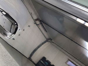 Oil-slick look of a ceramic coating applied to a black car