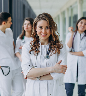 young-female-doctor-posing-corridor-hospital.jpg
