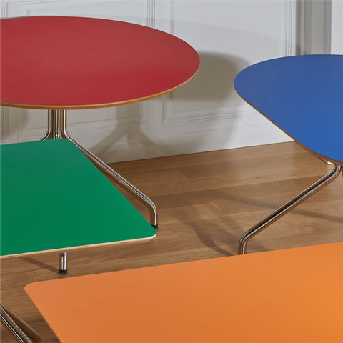 Multi-colored geometric side tables styled in a minimal interior setting