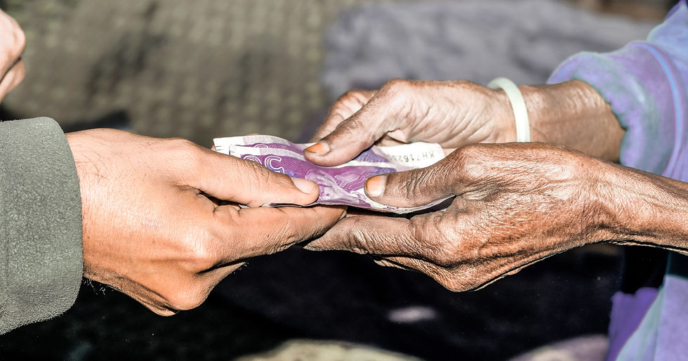 Two pairs of hands exchanging money.