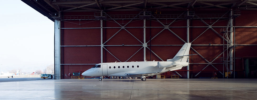 Private jet in airplane hanger.