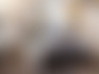 A college student sits across the desk from an academic advisor. 