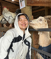 Volunteer with rescued goat