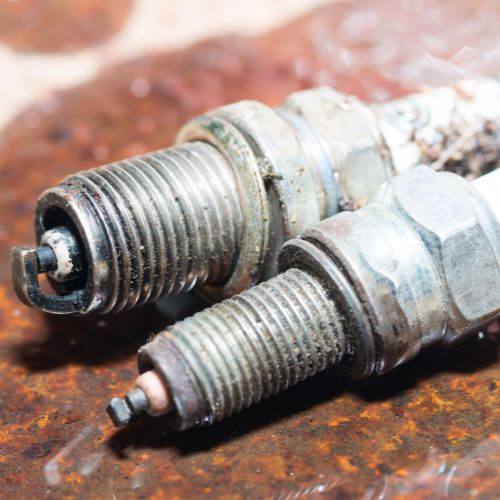 pair of worn sparkplugs