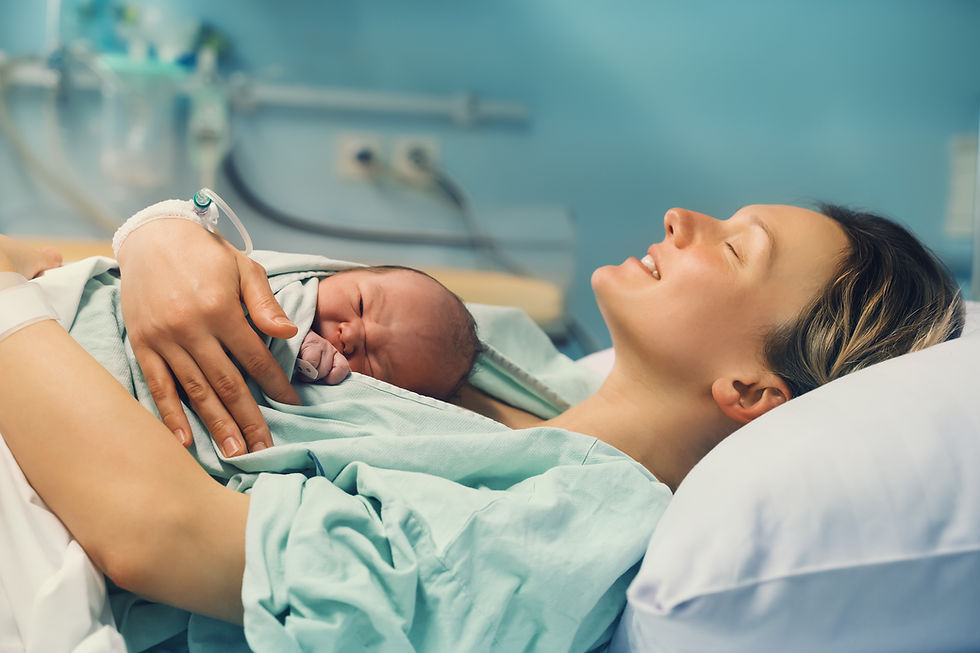 Mom in hospital enjoying her newborn baby
