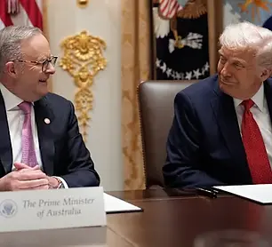 Photo of Anthony Albanese smiling at Donald Trump during their meeting. 
